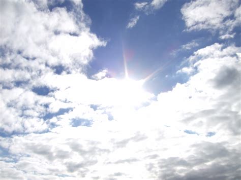 Free Photo Sun Behind Clouds Blue Clouds Rays Free Download Jooinn