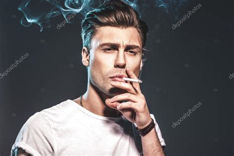 Handsome Young Man Smoking Cigarette — Stock Photo © Ua 53042897