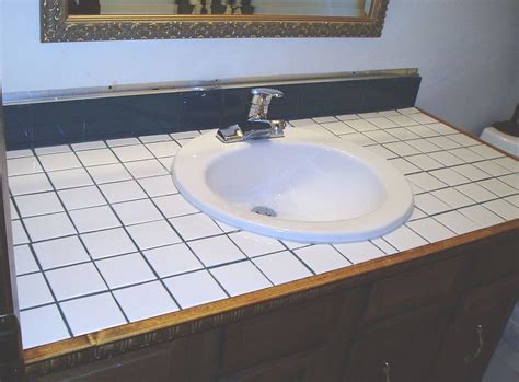 Improving the look of your bathroom can be as simple as replacing your old bathroom vanity countertops. Turn Tile Counter Top into Faux Sandstone | Tile ...