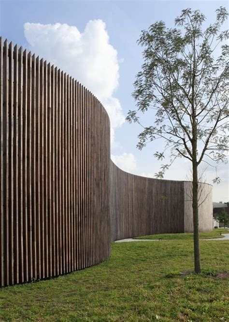 Exterior Curved Facade Made Of Vertical Wood Slats