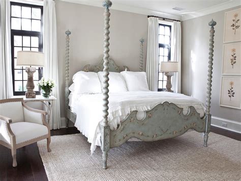 Romantic country french elegance in a master bedroom with muted color palette as well as aqua blue accents. Photos | HGTV