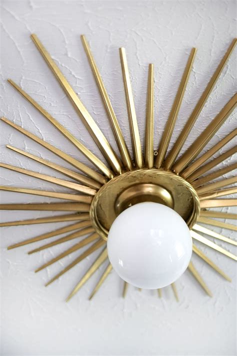 Installing a ceiling medallion can add personality and distinction to a room. Sunburst Mirror Medallion DIY - A Beautiful Mess