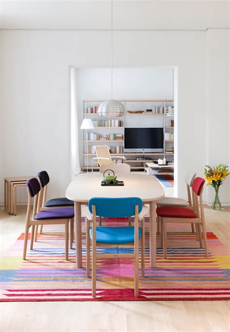 Colorful Dining Room With Multicolored Chairs