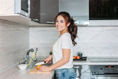 happy asian girl on kitchen by galina zhigalova on creativemarket beautiful long hair