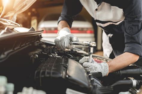 Automobile Mechanic Repairman Hands Repairing A Car Engine Automotive