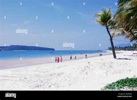 Pantai Cenang Beach With Tourists Walking Hi Res Stock Photography And