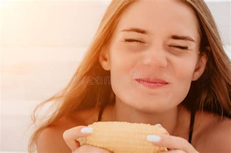 Woman Eats Corn On Beach Vegetarian Hipster Woman Eat Fresh Organic