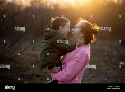 Close Up Of A Lovely Mother And Her Son Having Fun Outdoor Little Cute