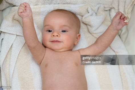 Happy Baby Boy After Bathtime High Res Stock Photo Getty Images