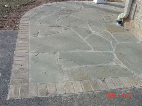 Brick Soldier Course Combined With Natural Stone Provide Pleasing