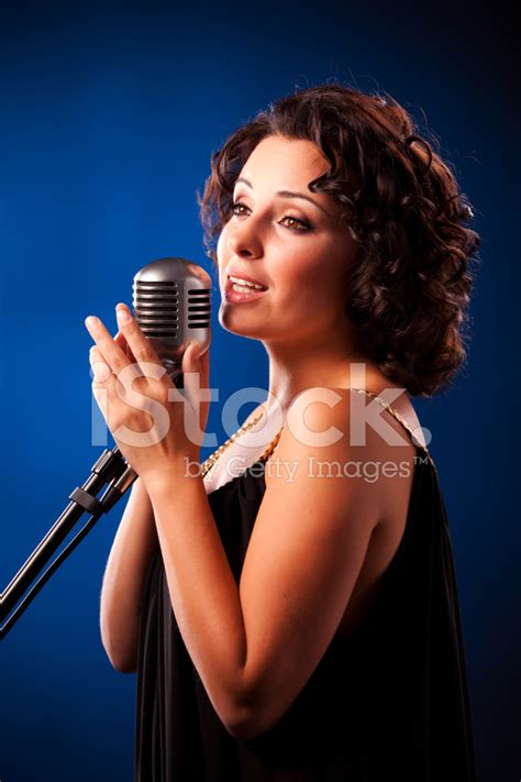 Woman Singing Into Microphone Stock Photo Royalty Free Freeimages