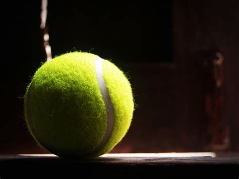 Tennis Ball On Tennis Racket On Floor · Free Stock Photo