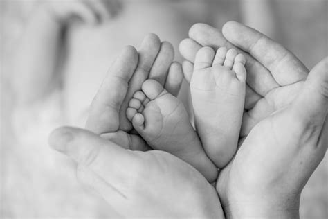 Baby Feet In Hands Of Parents Stock Photo Download Image Now Istock