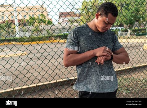 Athlete checking his heart rate Stock Photo - Alamy