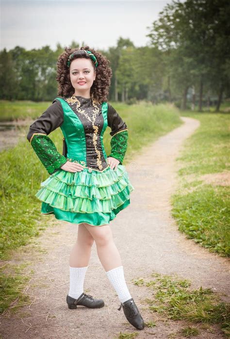 Young Beautiful Girl In Irish Dance Dress And Wig Posing Stock Image