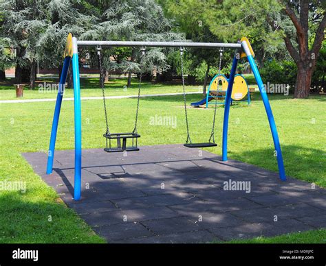 Swings Playground In The City Park Stock Photo Alamy