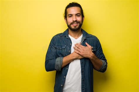 Grateful Young Smiling Man Hands Close To Chest Stock Photos Free
