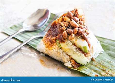 Simple Authentic Nasi Lemak Bungkus Wrapped With Banana Leaf Stock
