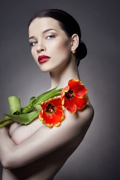 Premium Photo Nude Naked Girl With Tulips Flowers In Hand Makeup