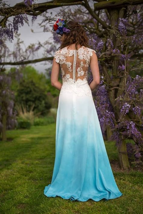 Stunning pool blue wedding dresses 2017 scoop neck short sleeve backless appliques blushing pink flower organza ruffle ball gown chapel train. Dip dyed wedding dresses are here, and they are absolutely...