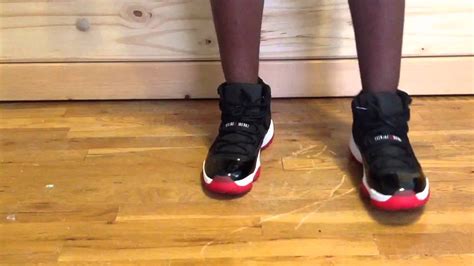 A white midsole melds nicely with a translucent varsity. Air Jordan XI 11 "BRED" on feet - YouTube