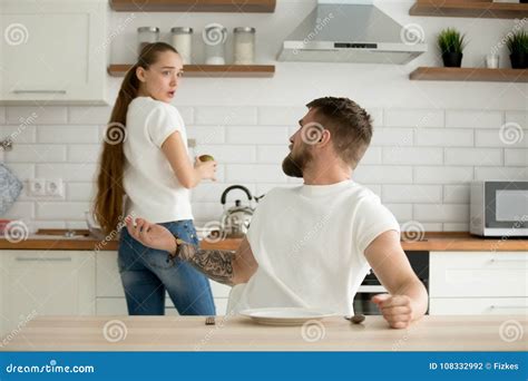 Angry Husband Shouting At Frustrated Wife Couple Arguing At Hom