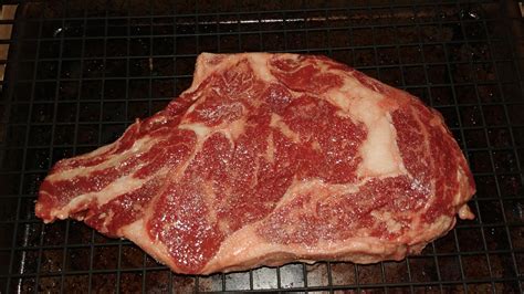 Longhorn selling uncooked steaks. 16 oz. Bone in Ribeye 1