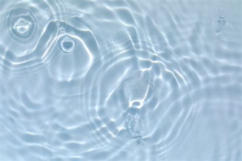 Transparent Blue Colored Clear Calm Water Surface Texture Stock Photo
