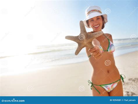 A Lady Holding A Starfish On The Beach Stock Image Image Of Bikini Bright