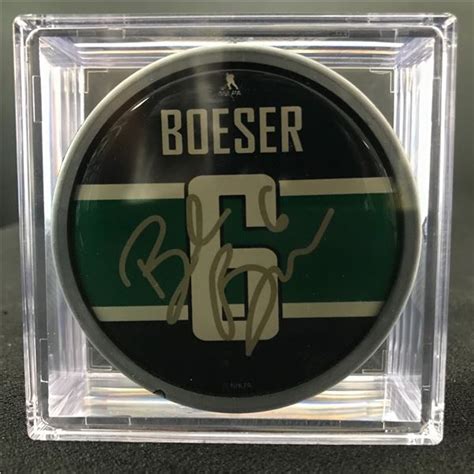 signed brock boeser hockey puck
