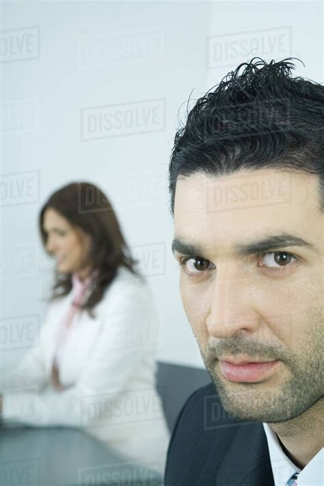 Businessman Glaring At Camera Stock Photo Dissolve