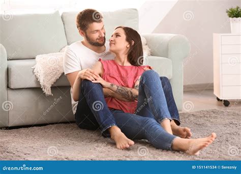 Happy Lovely Couple Sitting On Floor At Home Stock Photo Image Of