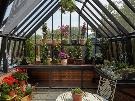 This charming little greenhouse is made from 4 window panels and 2 plywood panels. Greenhouse Accessories | Greenhouse Heating