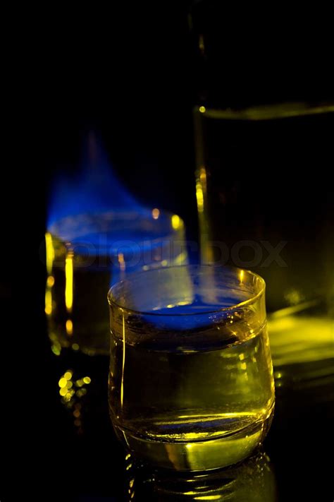 Dark Blue Flame Of Burning Alcoholic Drinks On A Black Background