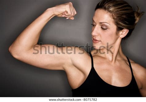 female bodybuilder flexing her biceps foto de stock 8075782 shutterstock