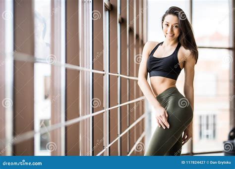 Beautiful Fitness Girl Posing Standing At Gym Portrait Of Confident