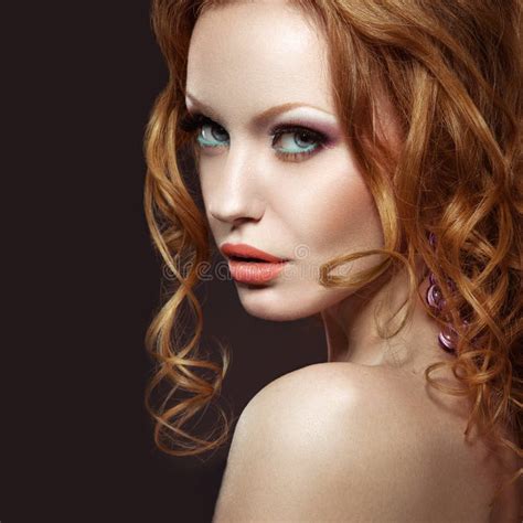 Beautiful Red Haired Girl With Bright Makeup And Curls Stock Image