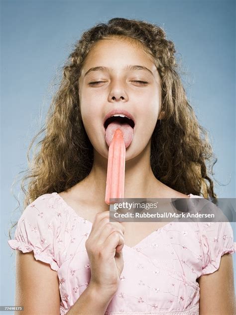 Girl Eating Popsicle High Res Stock Photo Getty Images