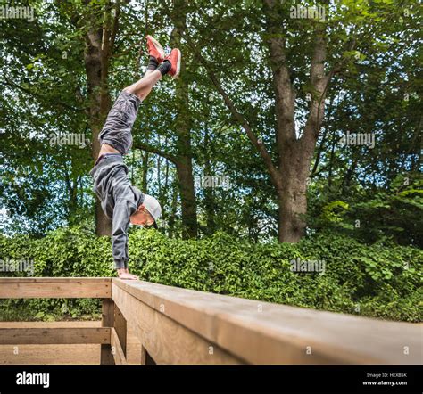 Boy Doing Handstand On Handrail Stock Photo Alamy