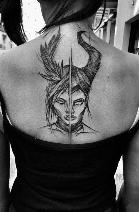 Separated Black Ink Upper Back Tattoo By Inez Janiak Of Demonic Women