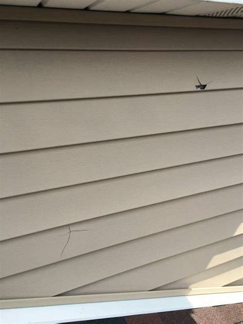 Hail Damage On Clients Home Vinyl Siding In This Picture Wind Damage