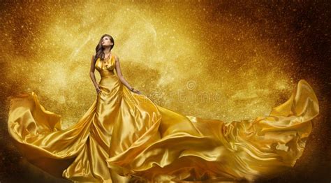 Gold Fashion Model Dress Woman Golden Silk Gown Flowing Fabric Stock