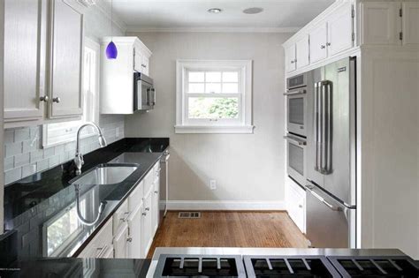 This unique floorplan gives new meaning to the phrase open concept with an expansive living and dining area and a spectacular kitchen that allows for the ultimate in entertaining. 2250 Woodford Pl Louisville, KY 40205 | MLS #1510809 Photo ...