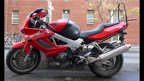 Compared to most other engines, you get higher horsepower, greater fuel efficiency, convenient controls and quieter operation. Honda VTR1000F V-twin sport bike (US - Superhawk, outside ...