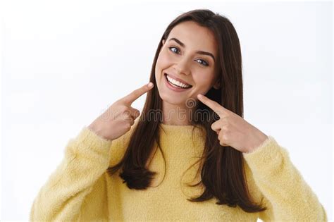 Romantic Tender Attractive Female In Yellow Sweater Embracing Herself