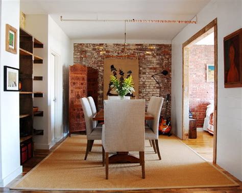 Airy white bedroom with whitewashed brick to accent brick wall painted turquoise becomes a focal point of the room. Brick Accent Wall | Houzz