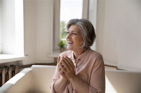 attractive older woman holding tea cup smile staring into distance stock image image of joyful