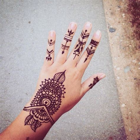 A typical henna design is depicted on the wearer's hand and fingers in this henna tattoo featuring a crescent moon on the wearer's middle finger. 150 Incredible Henna Tattoo Designs (Ultimate Guide, June ...