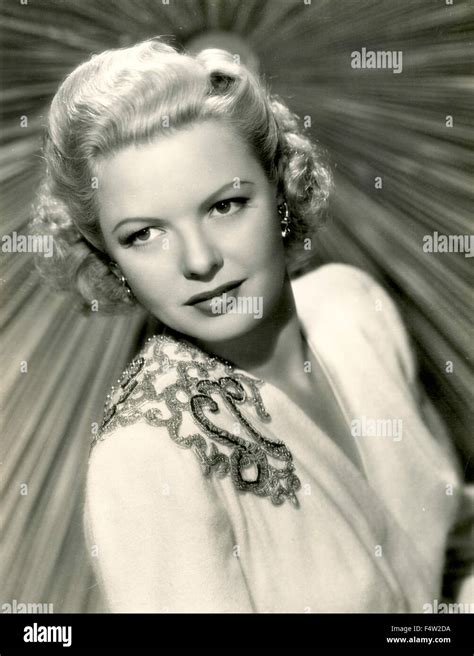 The American Actress Marjorie Reynolds In A White Dress Stock Photo Alamy