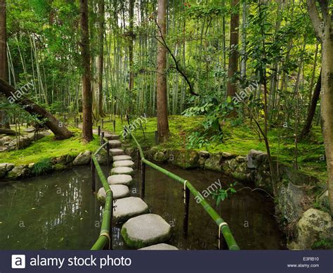 Japanese Zen Garden With Stepping Stones Over A Pond
